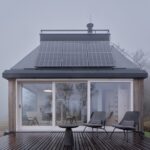 front-facade-open-glass-doors-solar-panels-terrace-cabin-devin-ark-shelter-archekta-boysplaynice-archeyes.jpg