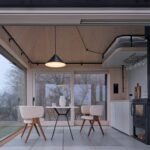 interior-dining-area-wood-stove-pendant-lamp-cabin-devin-ark-shelter-archekta-boysplaynice-archeyes.jpg